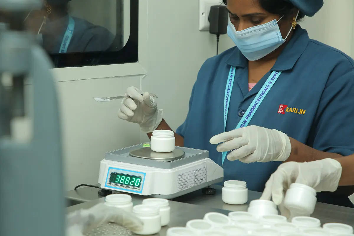 Quality control laboratory scientist testing pharmaceutical formulation